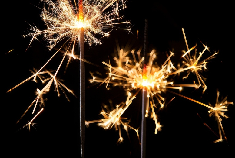 Sparklers on a black background.
