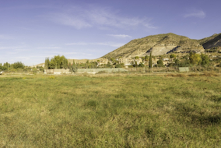 A breathtaking panoramic view of a stunning landscape with rolling hills and vibrant greenery