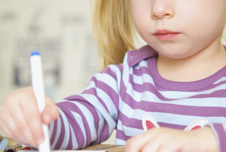 Girl drawing and coloring