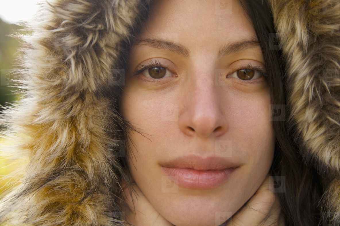 Close up of a young woman wearing a hooded parka