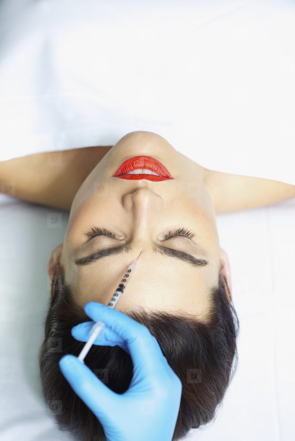 Woman Receiving Botox Injection on Forehead