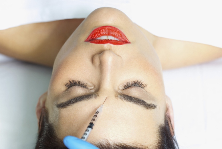 Woman Receiving Botox Injection on Forehead