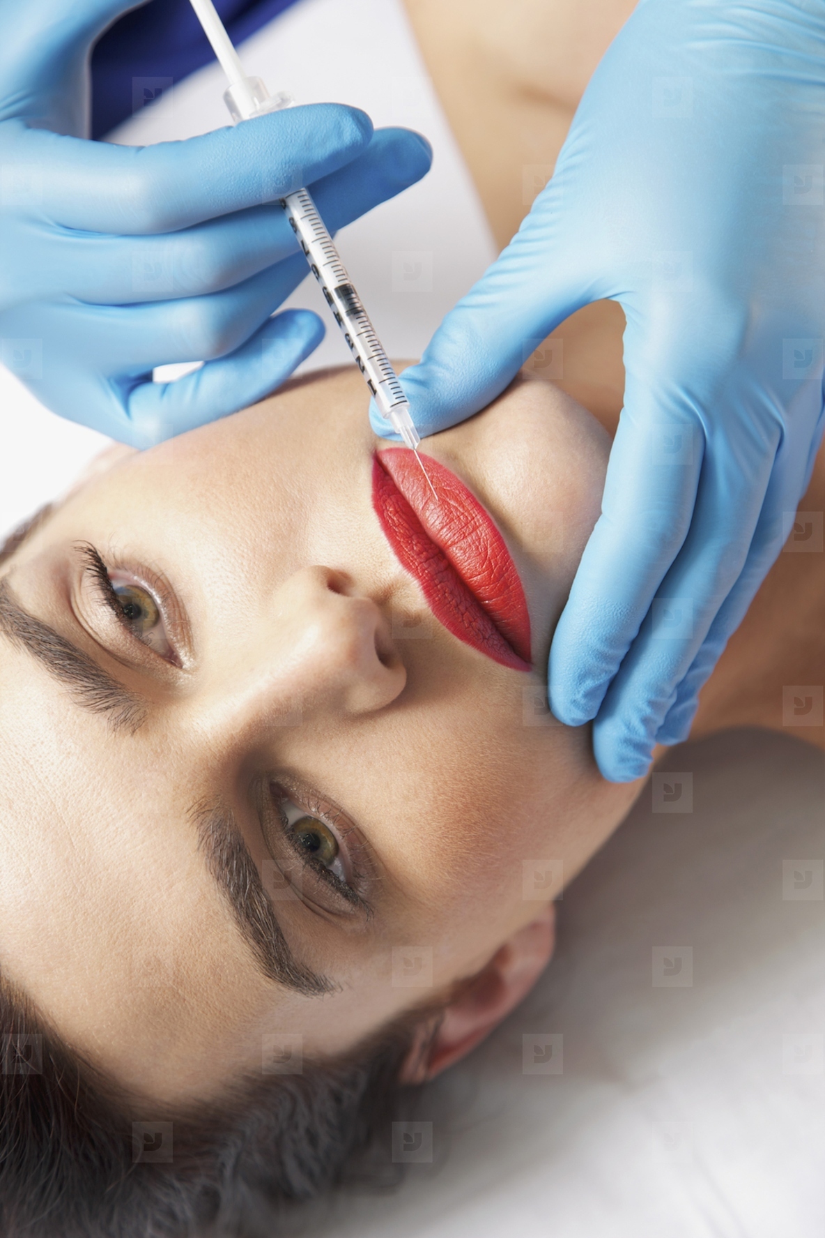Woman Receiving Botox Injection on Lips   Close up view