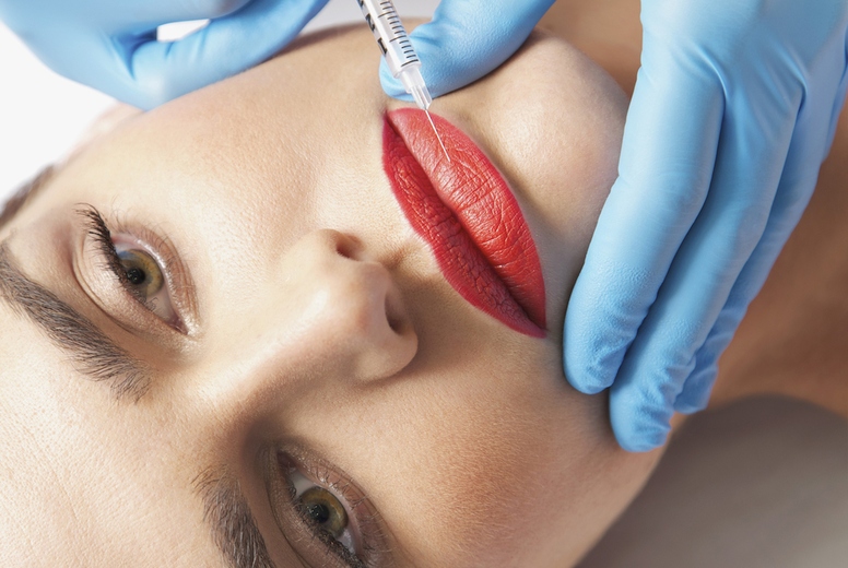 Woman Receiving Botox Injection on Lips - Close-up view