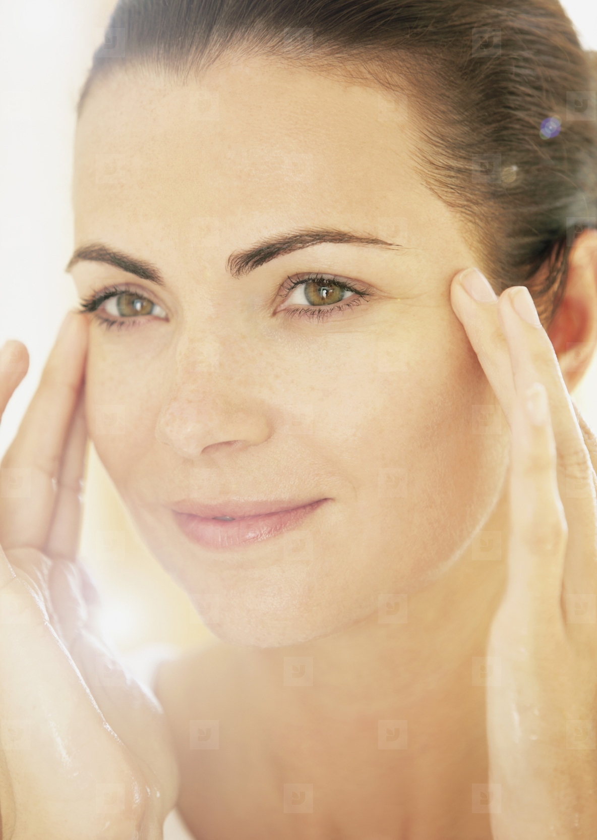 Smiling Woman with Hands on Face