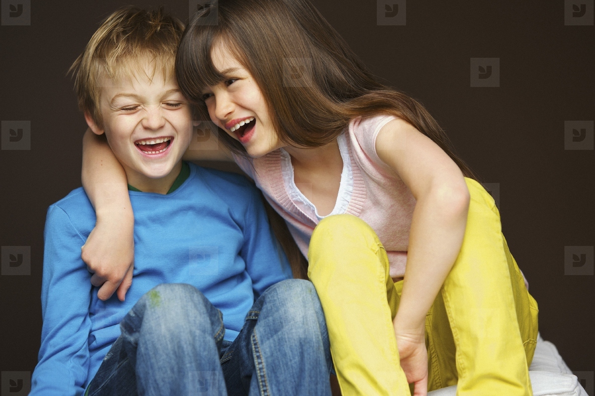 Boy and Girl Hugging and Laughing