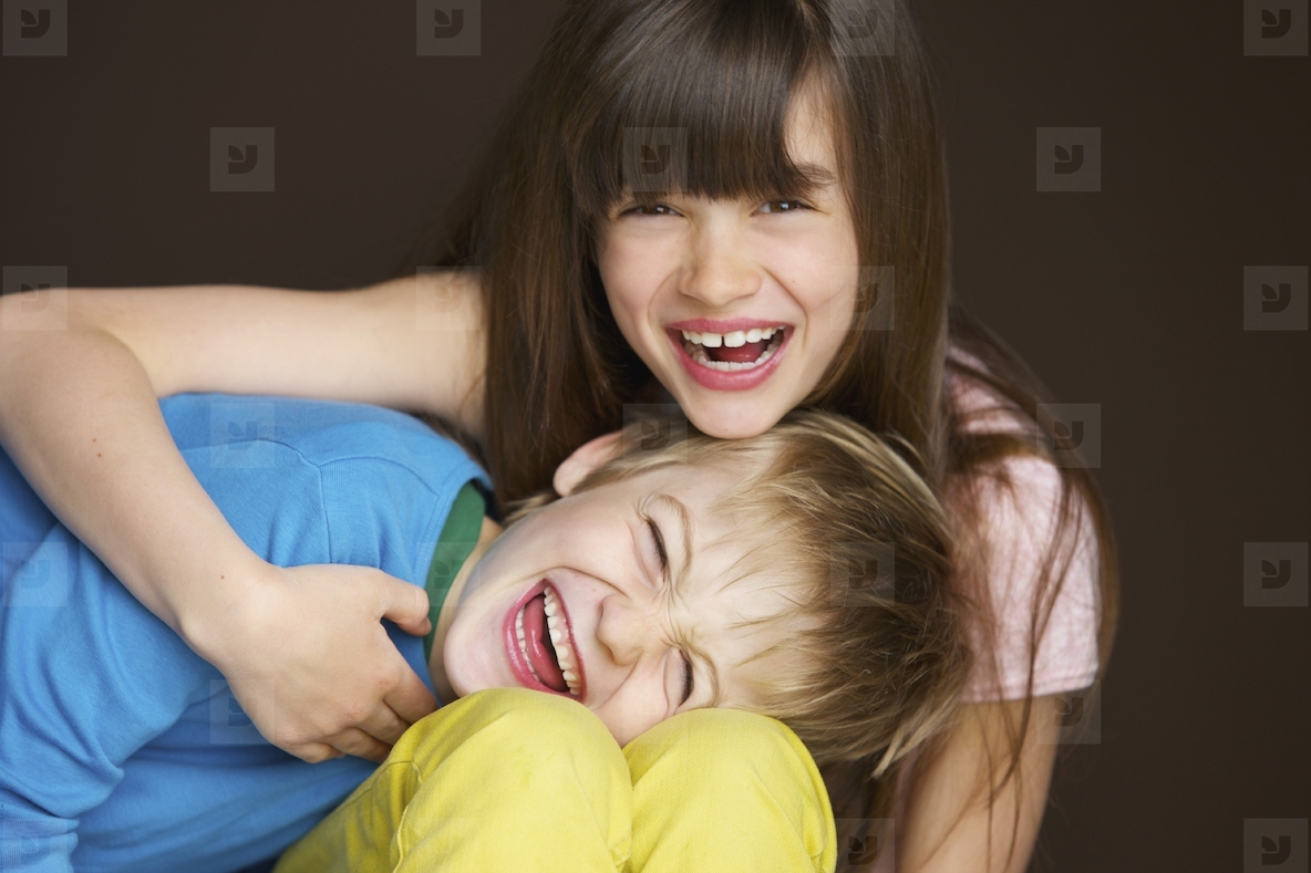 Boy and Girl Hugging and Laughing