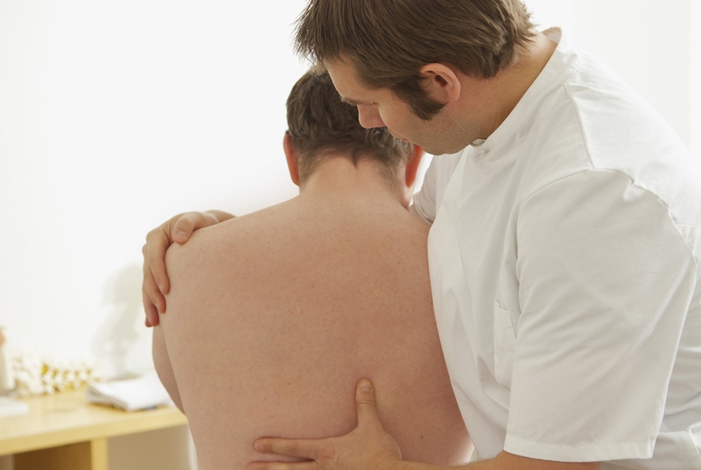 Osteopath Treating Male Patient