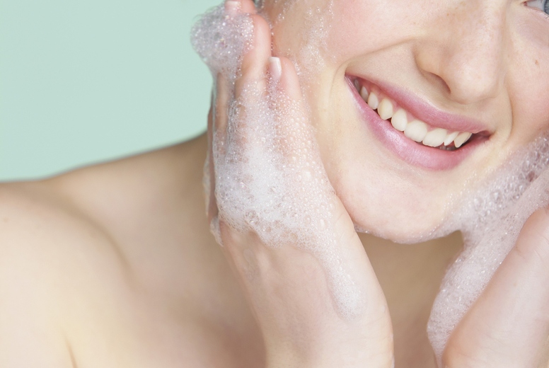Young Woman Washing Face