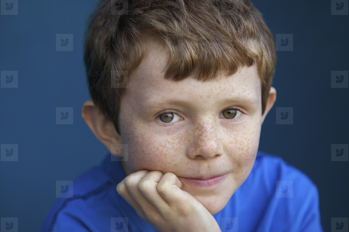 Portrait of Boy with Hand on Chin