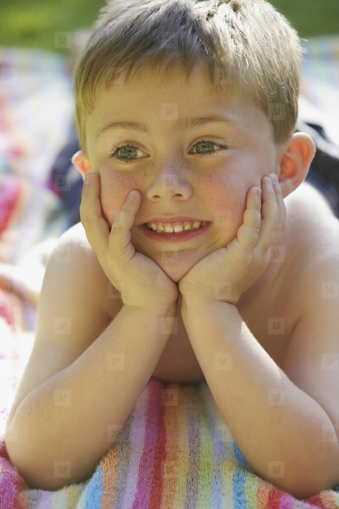 Young Boy with Hands on Chin