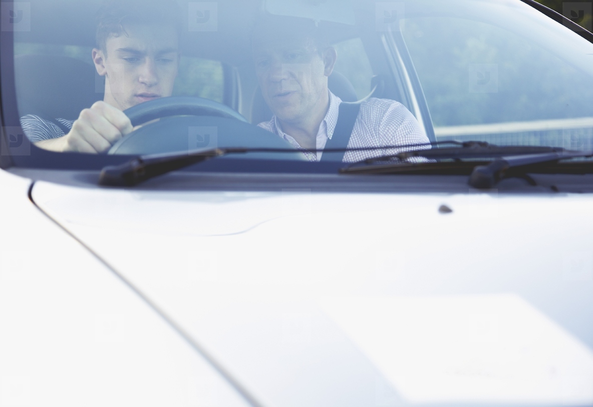 Father Teaching Son to Drive