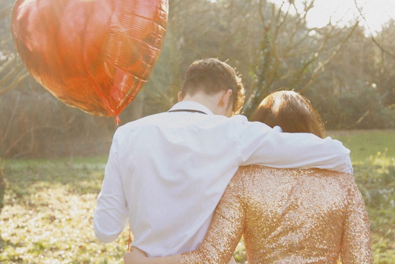 Couple in Park Holding Heart Shaped Balloon, Back View