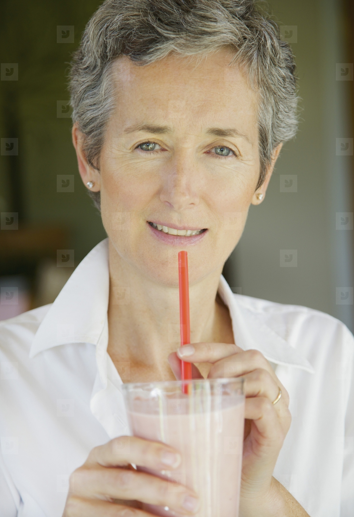Woman Drinking Smoothie with Straw