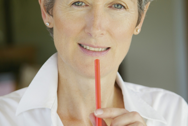 Woman Drinking Smoothie with Straw