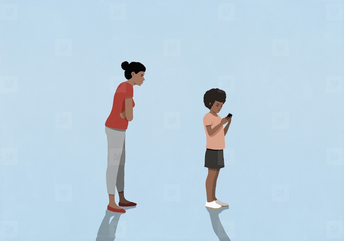 Angry mother with arms crossed watching daughter text messaging with smart phone