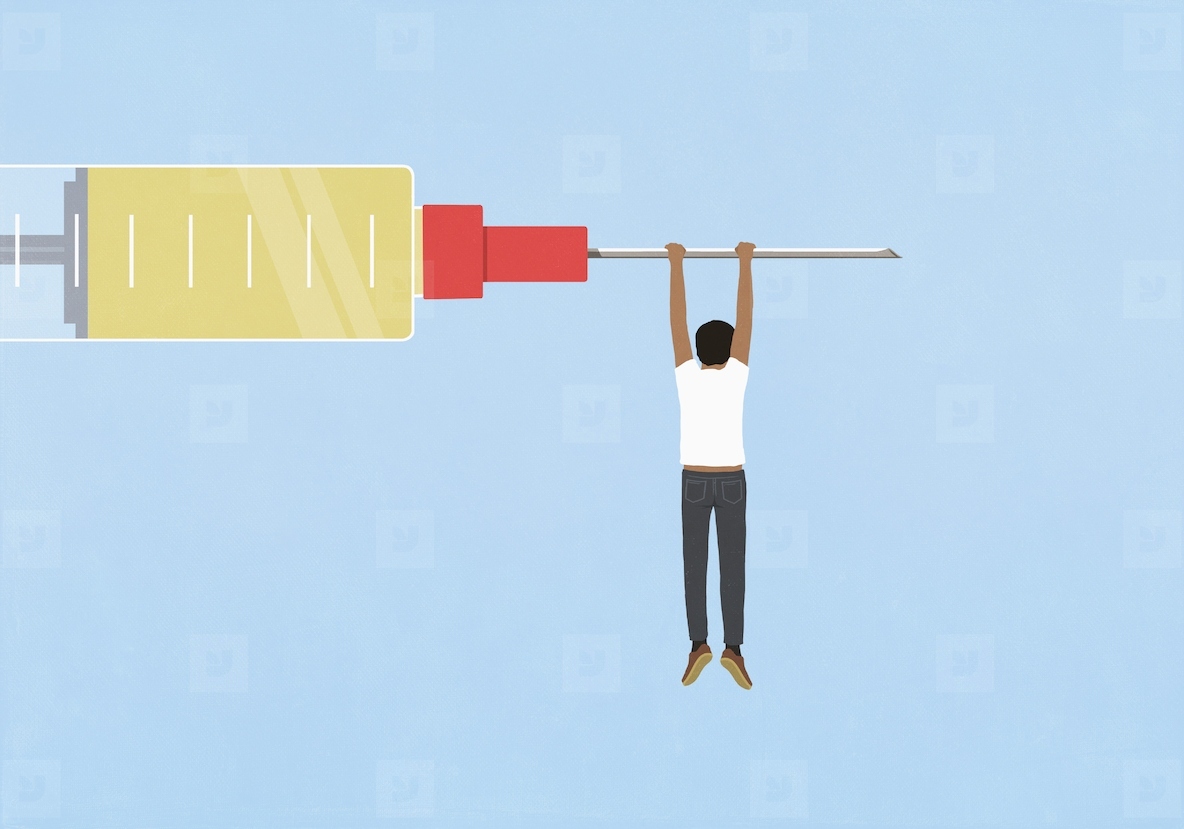 Man hanging from large syringe on blue background