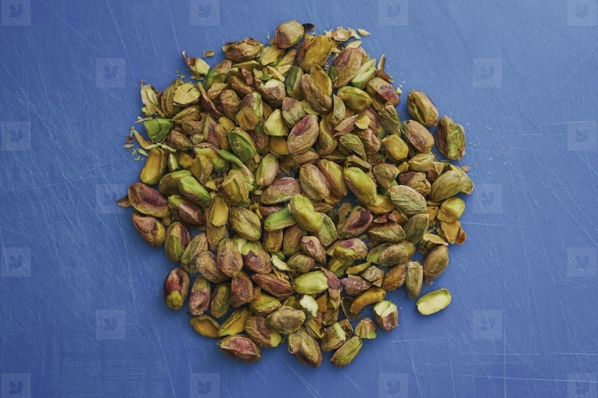 View from above pile of freshly shelled pistachio nuts