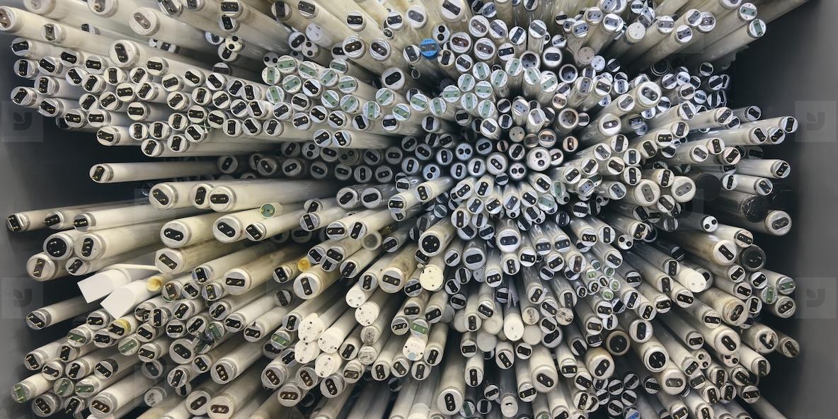 View from above large group of fluorescent tube lights on end