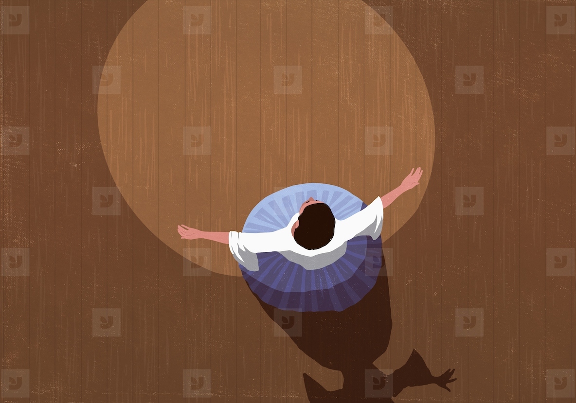 View from above opera singer with arms outstretched performing on stage in spotlight