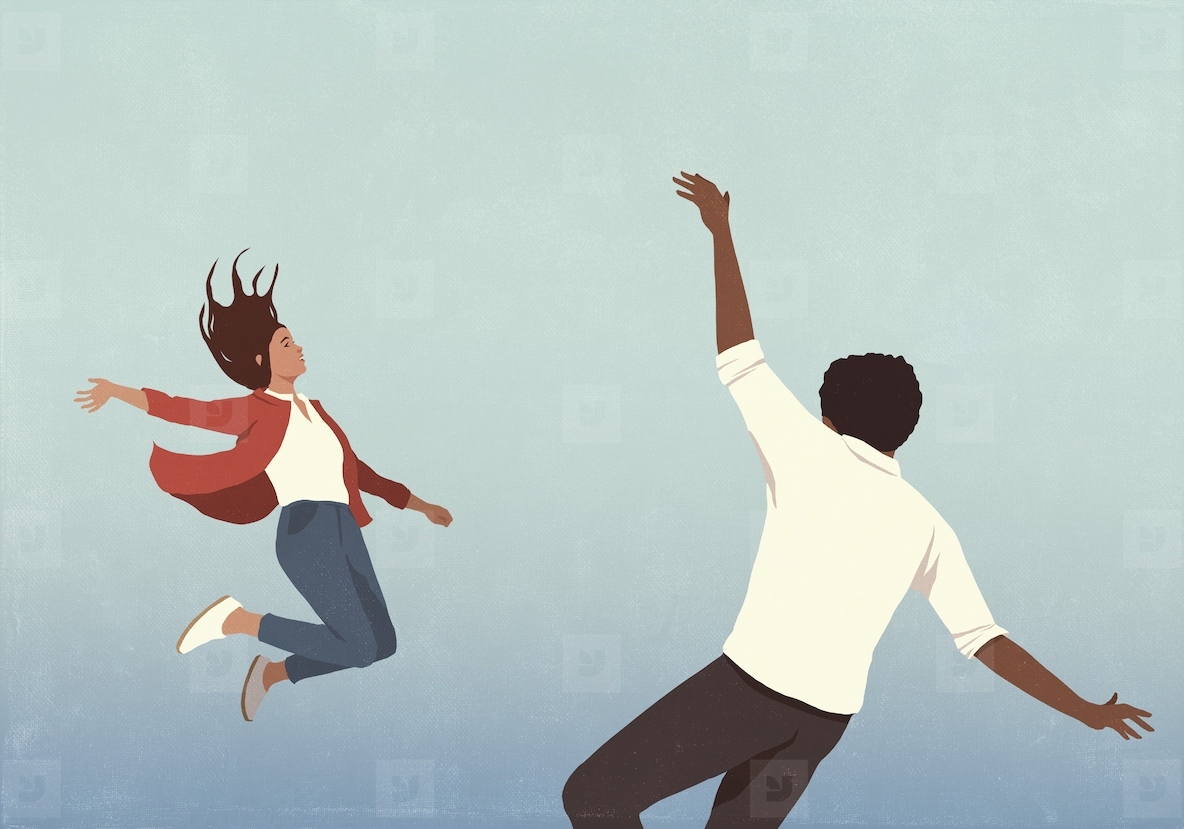 Couple free falling against blue background