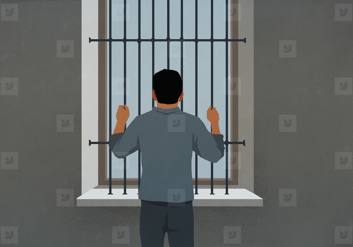 Man behind bars looking out window