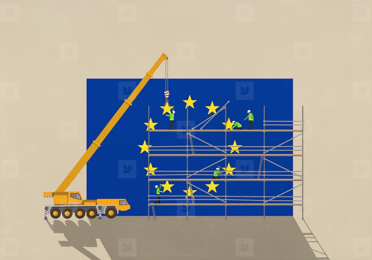 Crane and construction workers on scaffolding assembling European Union flag