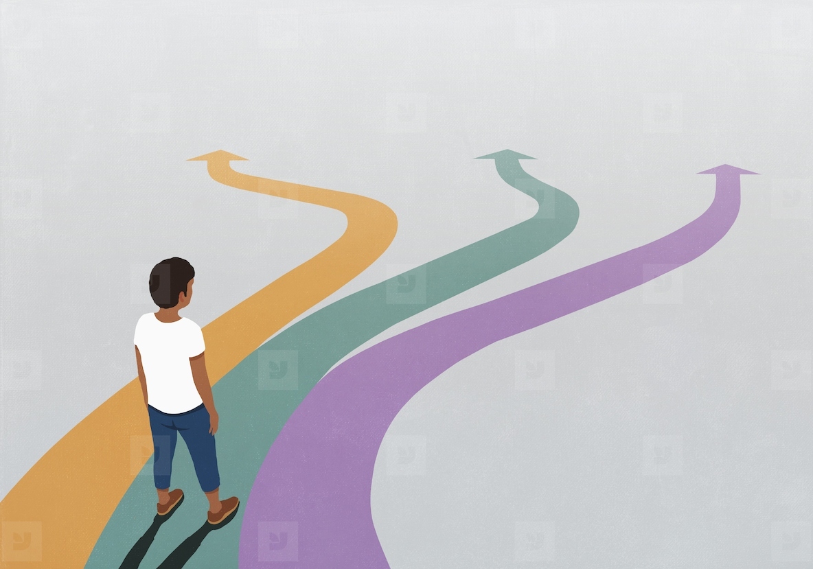 Man looking down at three multicolored arrow paths spreading before him