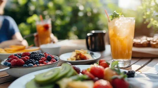 vibrant outdoor brunch with fresh fruit and iced tea