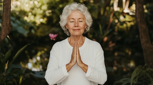 Elderly woman practicing yoga in garden  serene expression