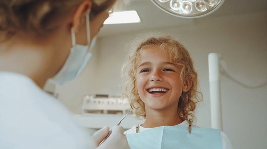 Smiling child at dentist office during checkup