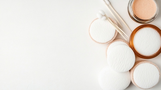 Cotton swabs and facial pads on white background  Minimalist skincare concept