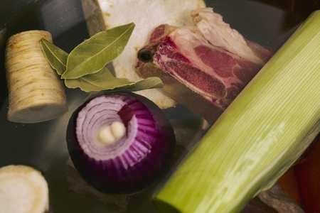 Still life close up vegetables bay leaf and meat soup ingredients