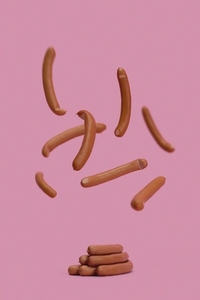 Bavarian sausages falling midair