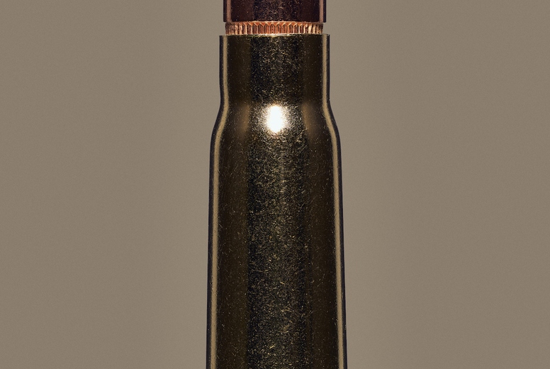 Close up studio shot of 39mm bullet used with AK47