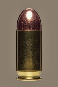 Close up studio shot of shiny 45 bullet