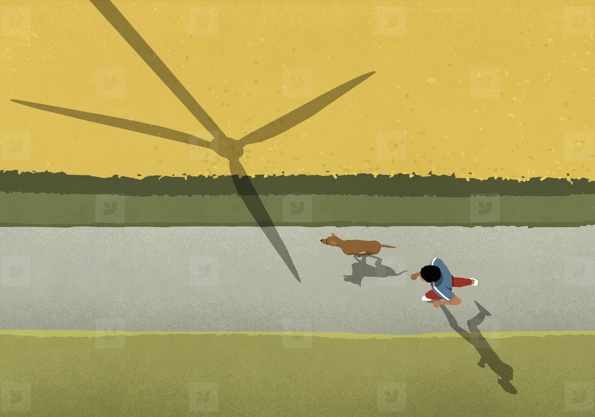 View from above man and dog jogging on path along field