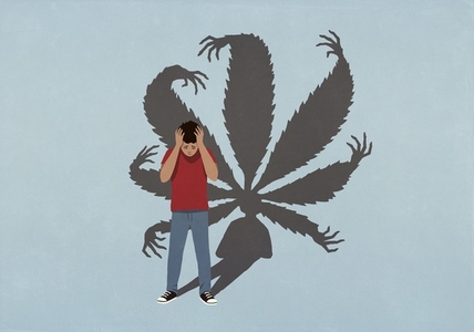 Cannabis leaf shadow with hands looming