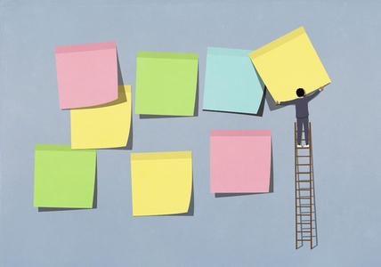 Businessman on ladder arranging multicolor adhesive notes