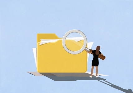 Businesswoman holding large magnifying glass