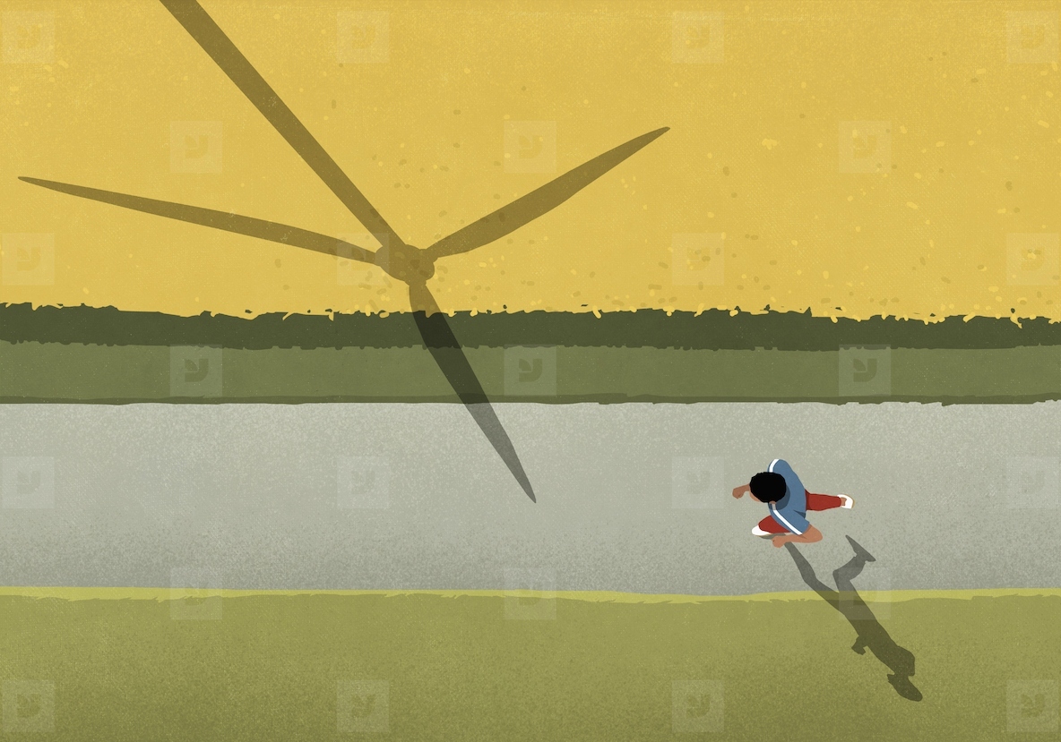 View from above man jogging on path along rural field