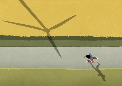 View from above man jogging on path along rural field