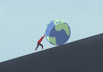 Woman pushing large globe uphill