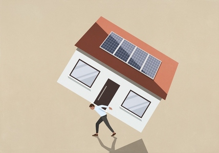 Man carrying large heavy house with solar panels on back