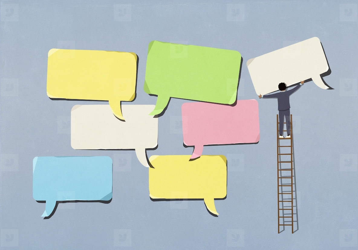 Businessman on ladder arranging large multicolored speech bubbles