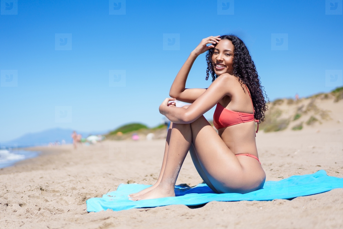 A Vibrant SunKissed Beauty Enjoying the Warmth of Summer at the Gorgeous Beachside Location
