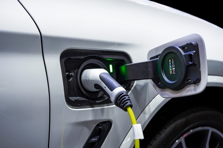 Power cable pump plug in charging power to electric vehicle EV c Power cable pump plug in charging power to electric vehicle EV c