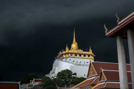 Golden mountain in Wat Saket Bangkok Thailand covered with dark Golden mountain in Wat Saket Bangkok Thailand covered with dark