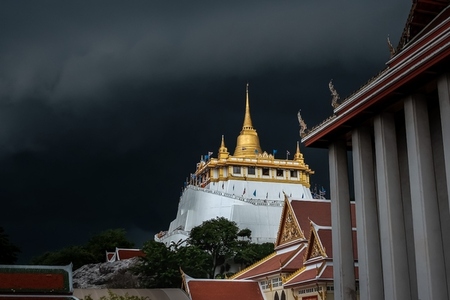 Golden mountain in Wat Saket Bangkok Thailand covered with dark Golden mountain in Wat Saket Bangkok Thailand covered with dark