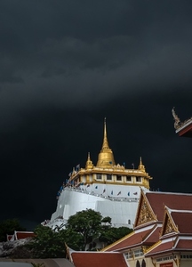 Golden mountain in Wat Saket Bangkok Thailand covered with dark Golden mountain in Wat Saket Bangkok Thailand covered with dark